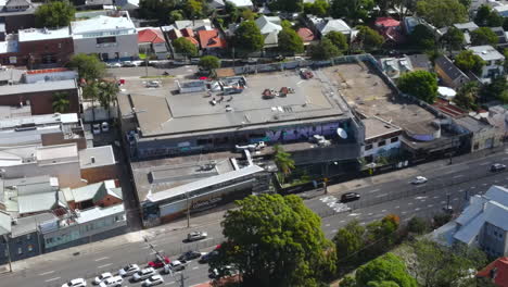 Aerial-shot-of-Australian-roads-in-busy-suburb-with-heavy-traffic-and-businesses