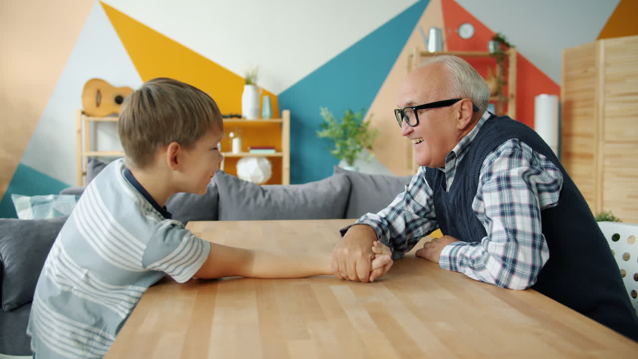 Grandfather and Grandson Arm Wrestling