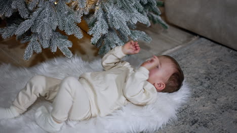 baby under the christmas tree