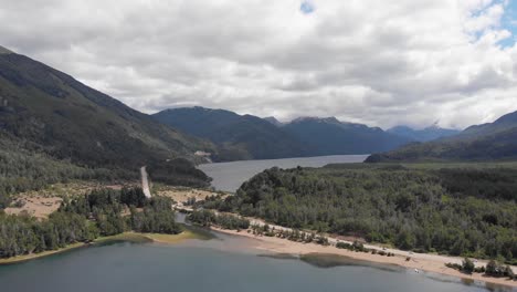 Lago-Falkner-in-foreground-with-Lago-Villarino-beyond,-nature-aerial