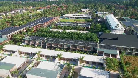 a modern, eco-friendly resort in ubud, bali, featuring tropical design and surrounded by palm trees. solar panels power the retreat, offering sustainable luxury in harmony with bali’s natural beauty.