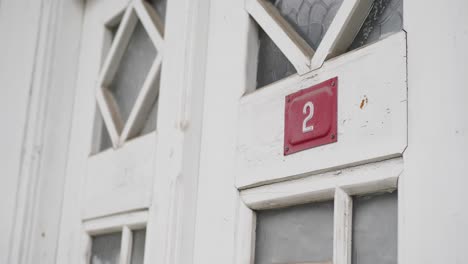 house number 2 on a white door