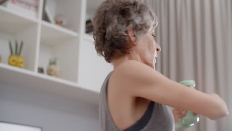 senior woman doing arm workout at home