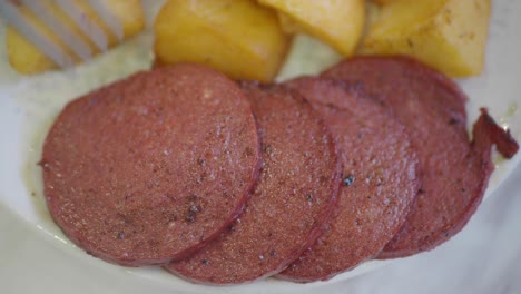 sliced sausage with roasted potatoes