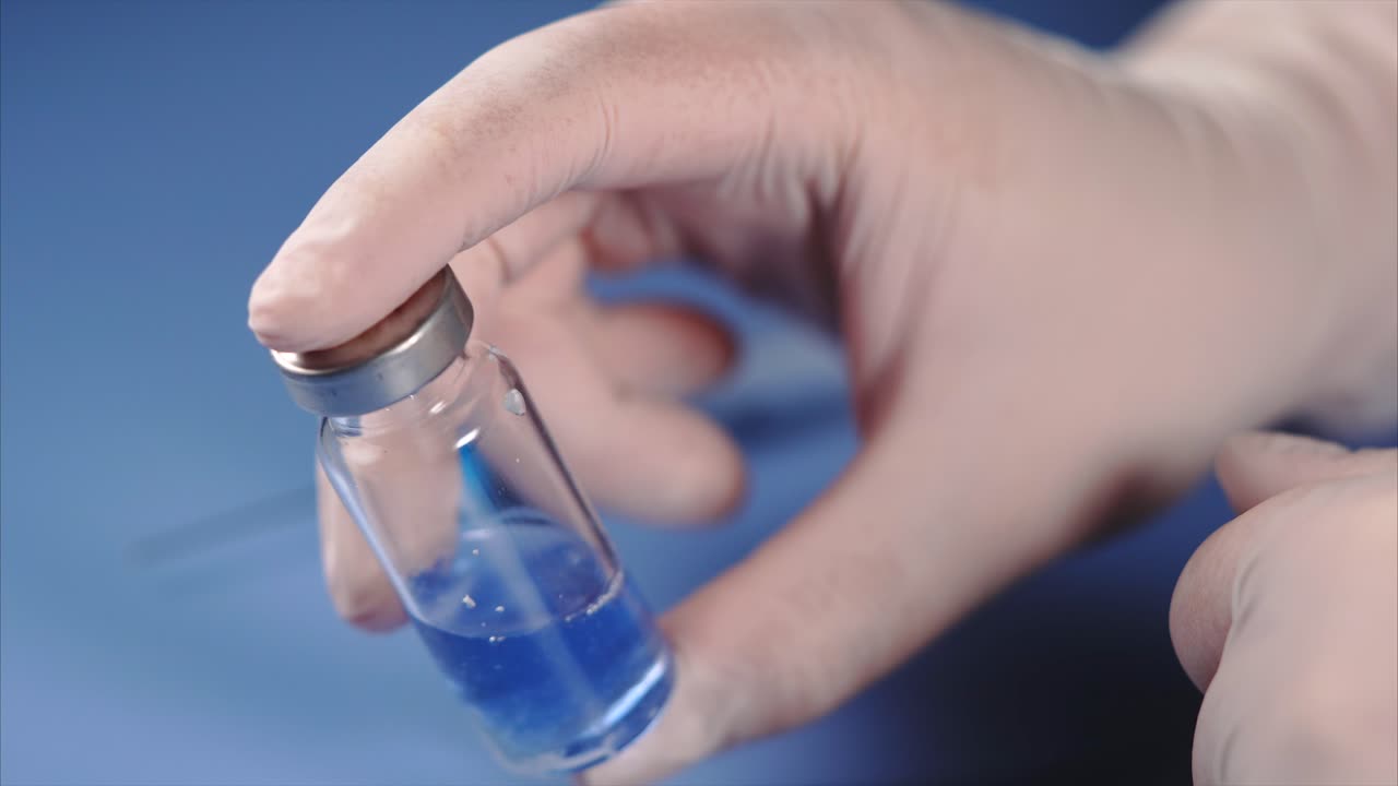 Medical professional preparing a vaccine injection