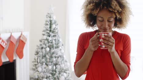 Pretty-young-African-woman-enjoying-coffee