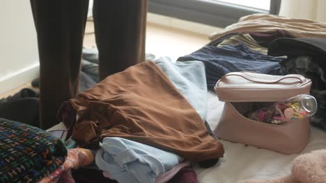 sorting and organizing clothes with accessories