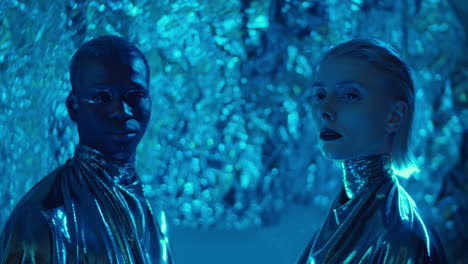 Extraterrestrial Man and Woman Posing in Studio with Laser Light