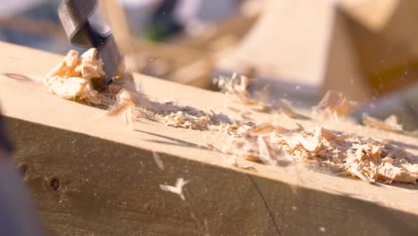 drilling a hole in a wooden beam