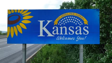 kansas welcomes you road sign