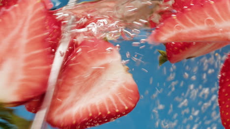 fresh strawberries underwater splash