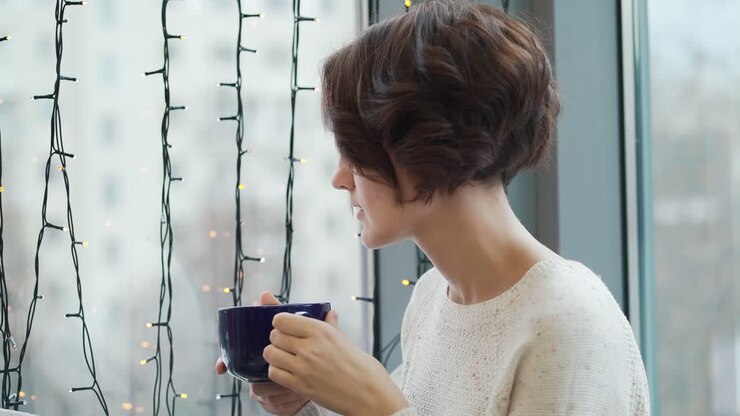 Woman drinking coffee in a cafe