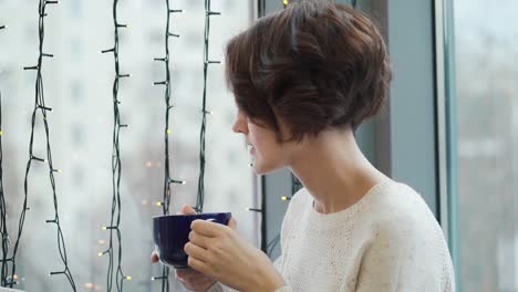 woman drinking coffee in a cafe