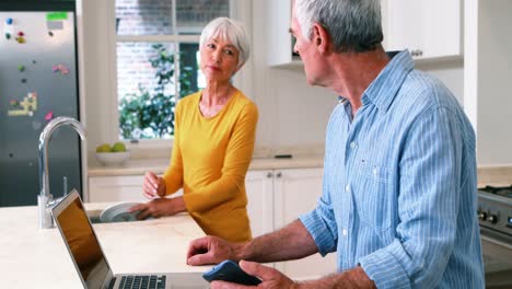 Parents-and-kids-having-fun-while-watching-television-in-living-room