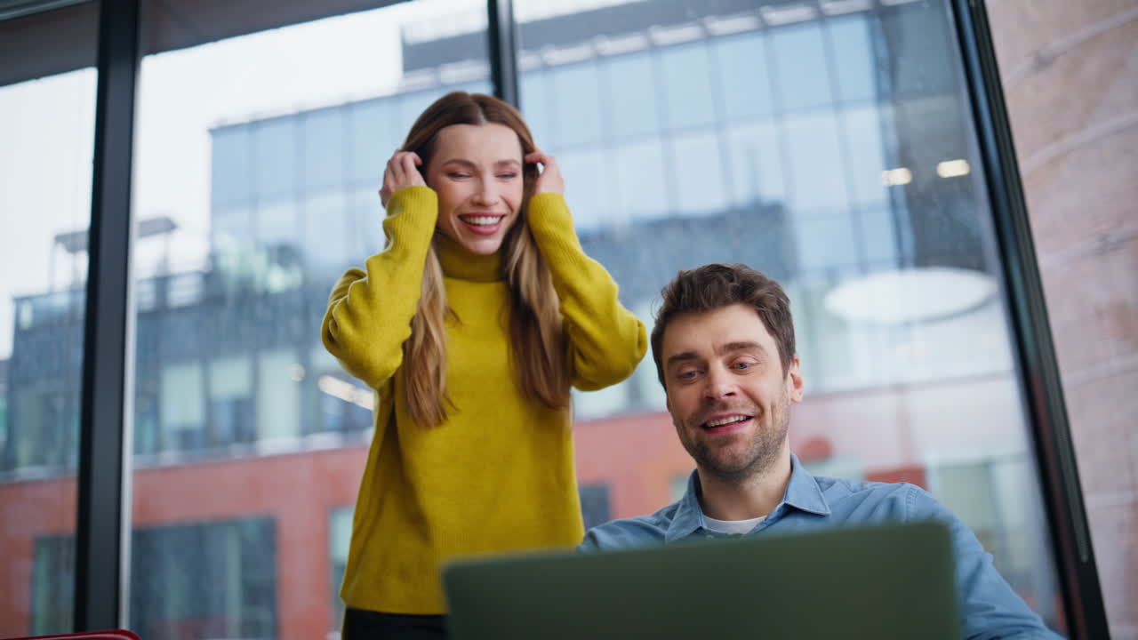 Smiling startupers talking online conference in office closeup. Happy woman man