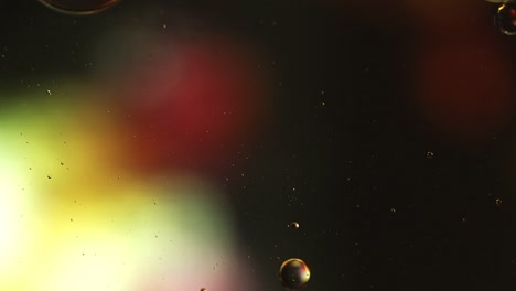 abstract colorful food oil drops bubbles and spheres flowing