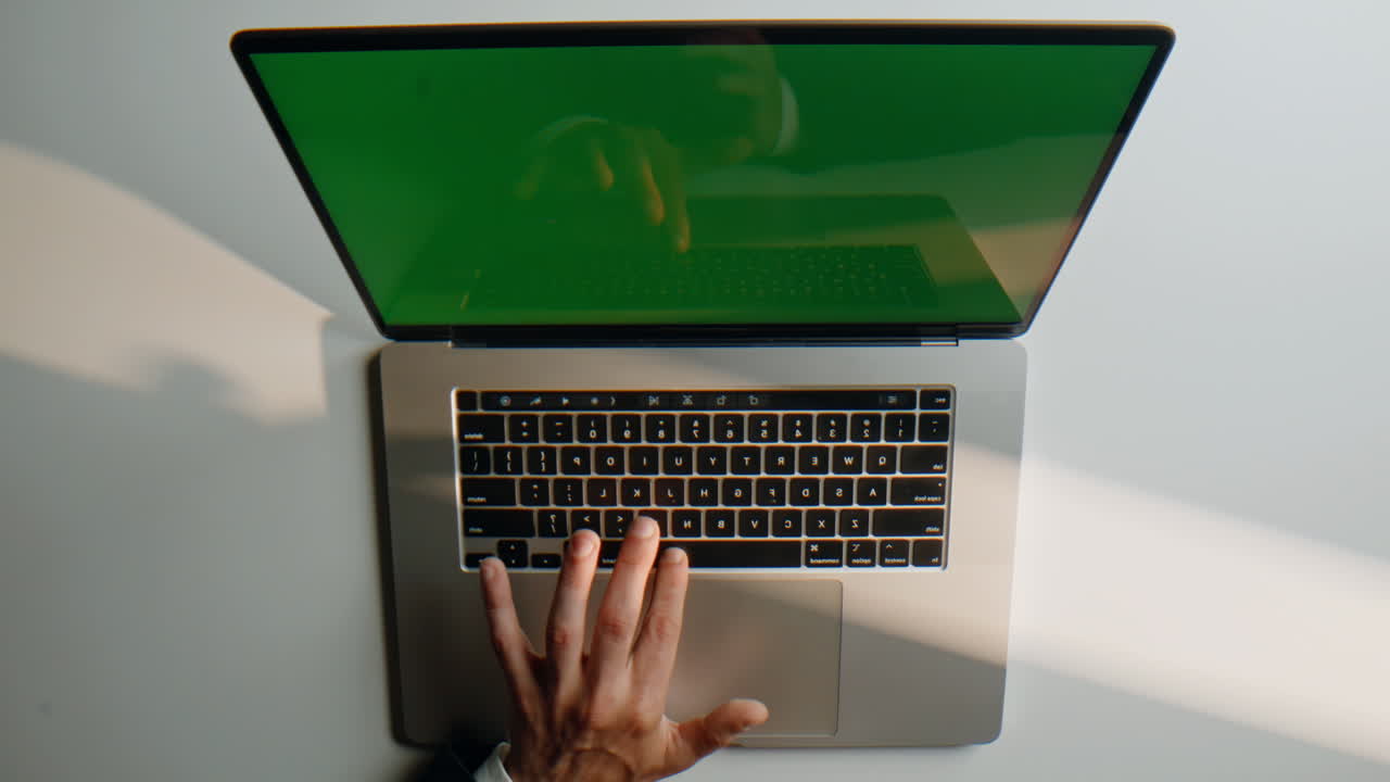 Hand using mockup laptop button professional indoor workspace closeup top view