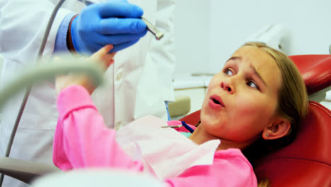 Young-patient-scared-during-a-dental-check-up