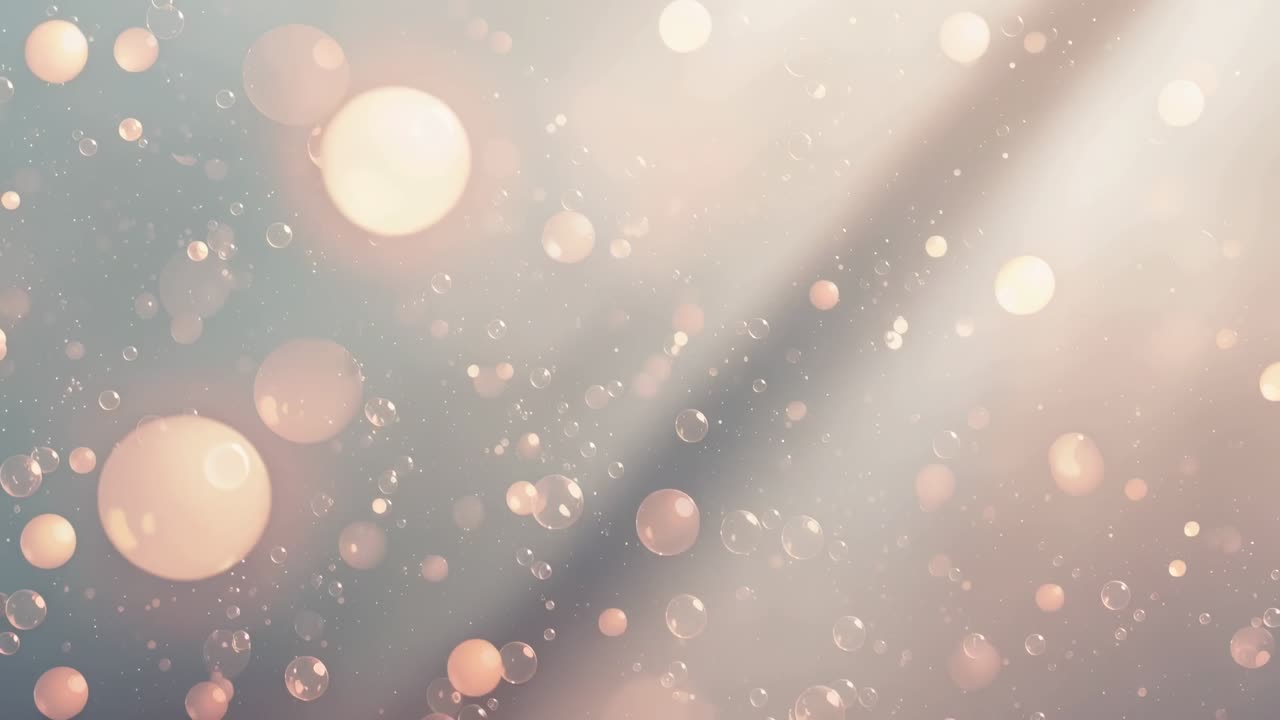 Drifting clear spheres and warm bokeh as frames advance, appearing and growing over pastel backdrop