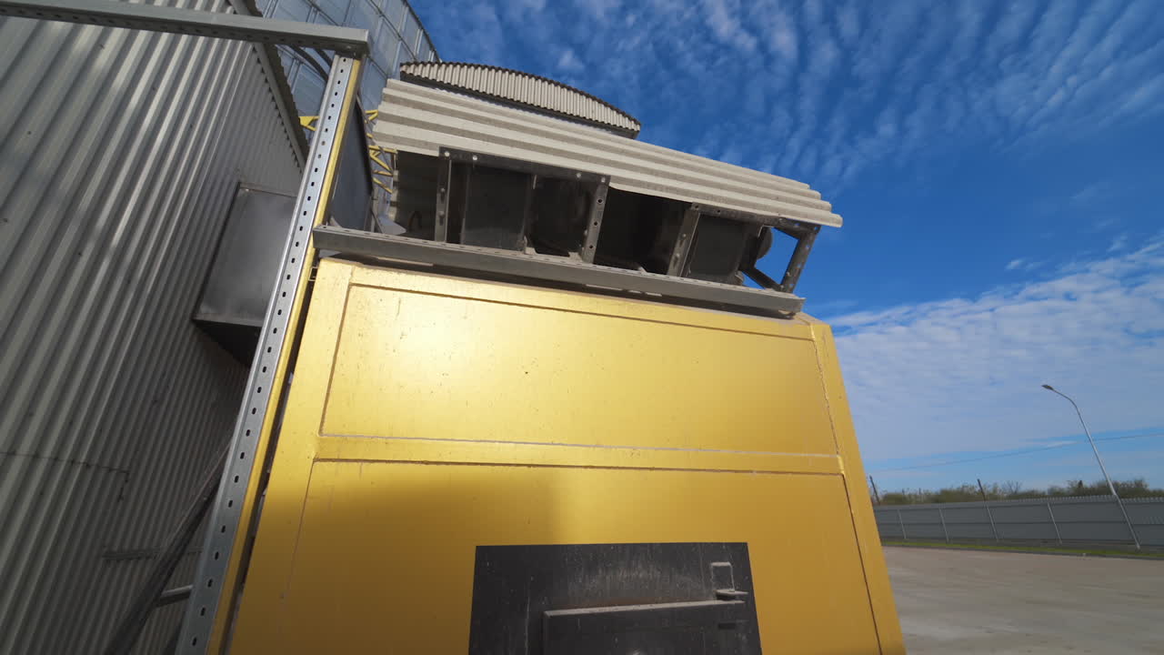 Large industrial plant with special equipment for processing crop. Industrial oven in the agricultural factory. Exterior of grain dryers farm.