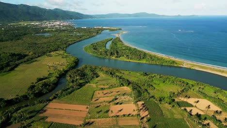 pajo rivermouth into the philippine sea in virac, catanduanes. aerial drone shot