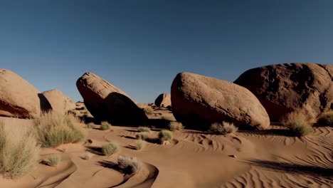 desert landscape with boulders and sand dunes