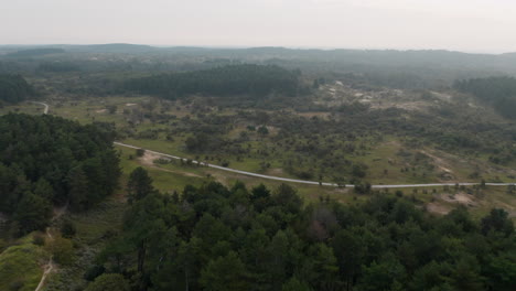 Drone-Fly-Over-Zuid-Kennemerland-National-Park-With-Forest-Trail-In-North-Holland,-Netherlands