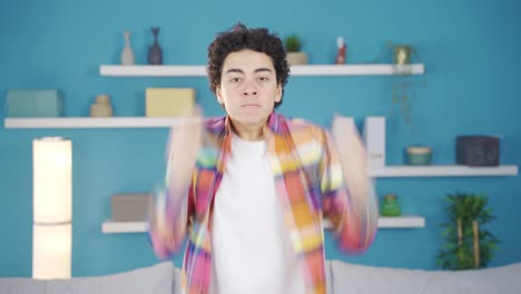 the young man looking at the camera gets frustrated and angry.