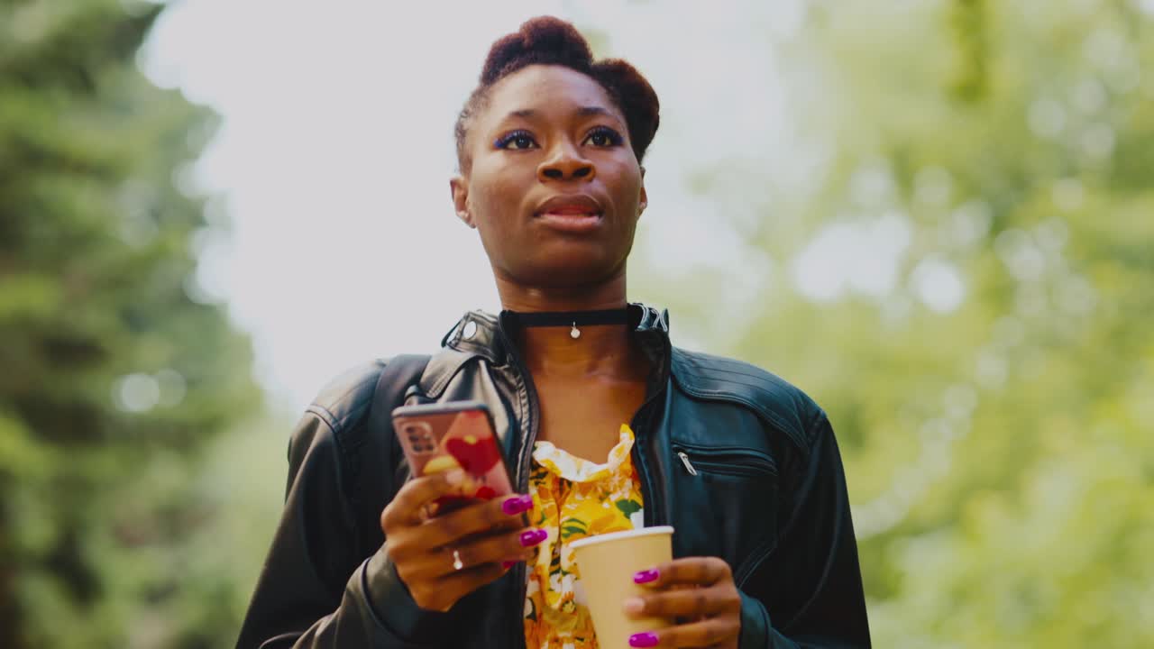 Woman using smartphone in park