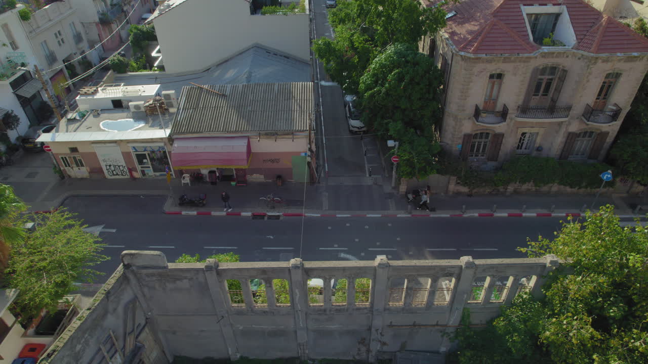 Narrow road near a colorful old buildings in Neve Tzedek Neighborhood in Tel Aviv - the area has been completely re-gentrified and Neve Tzedek is now one of Tel Aviv's trendiest districts