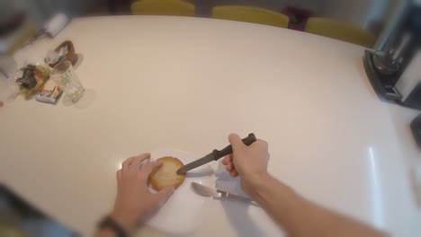 POV-first-person-making-european-breakfast-with-tiny-bread-butter-jam-and-honey-setting-up-and-toasting