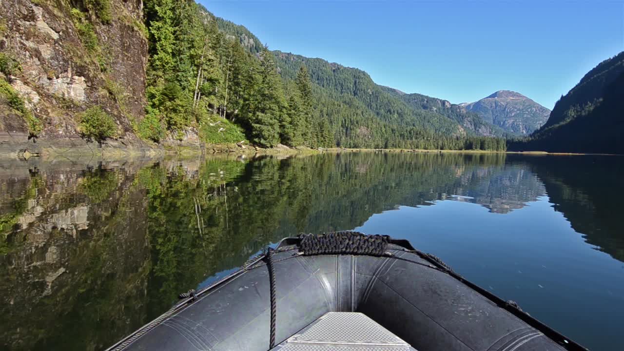 POV boat ride cruising through a glassy waters in Fords Terror in Tracy ArmFords Terror Wilderness Area Southeast Alaska 2
