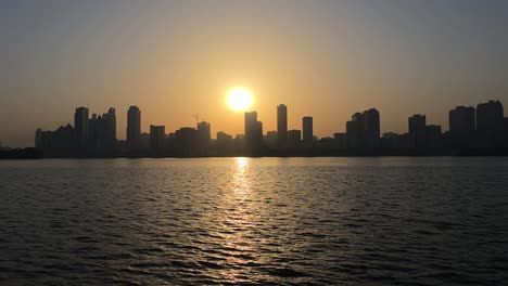 sunrise over sharjah skyline in the uae