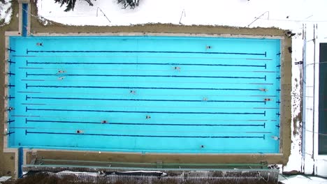 swimmers practice in swimming pool winter. aerial shot