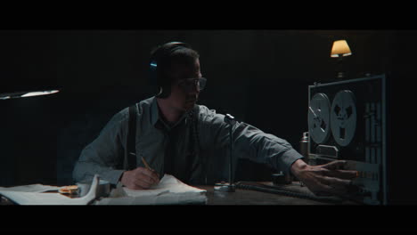 an intelligence officer listens to the wiretap recordings