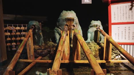 futami shrine at night, frog fountain hand purification basin, tilt shot