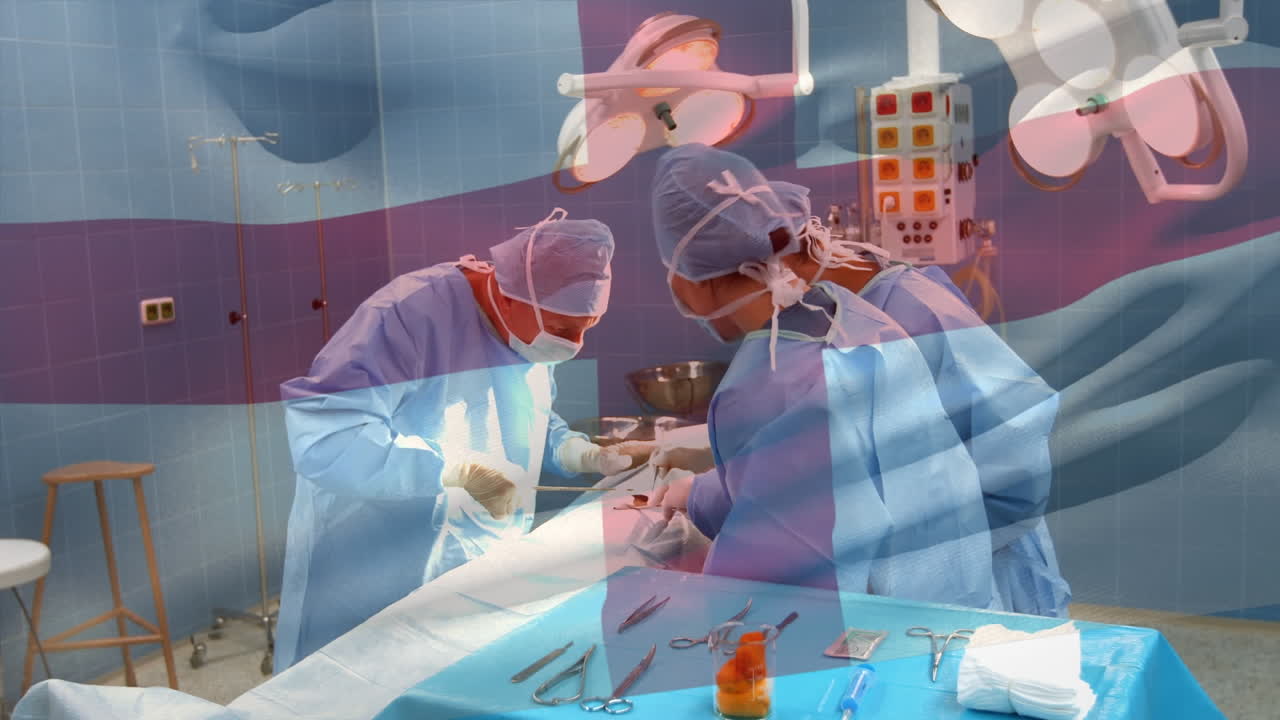 수술실에서 외과 의사 들 위 에 흔들리는 영국 국기 의 애니메이션