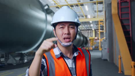 engineer expressing disagreement in industrial setting