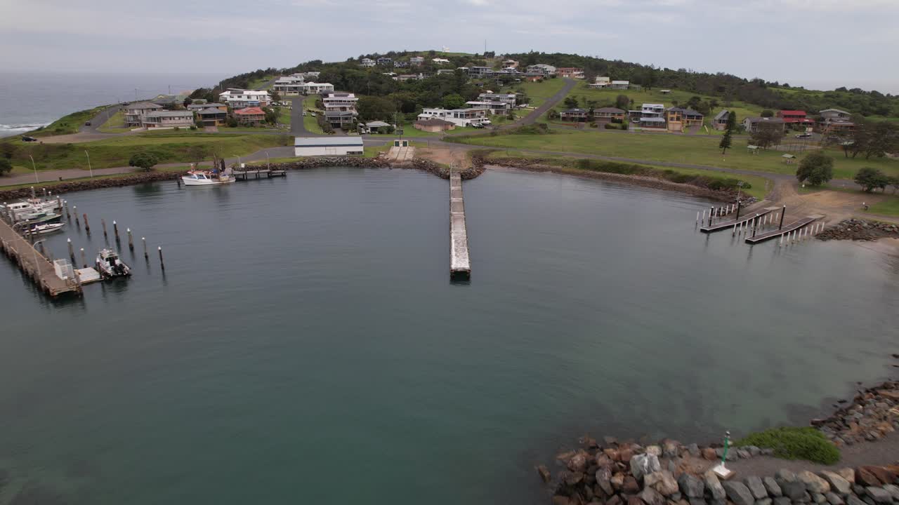Crowdy Head Jetty, Houses And Boat Harbor In NSW, Australia. - aerial shot