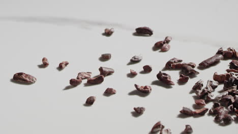 Cacao-nibs-sliding-and-bouncing-across-a-countertop