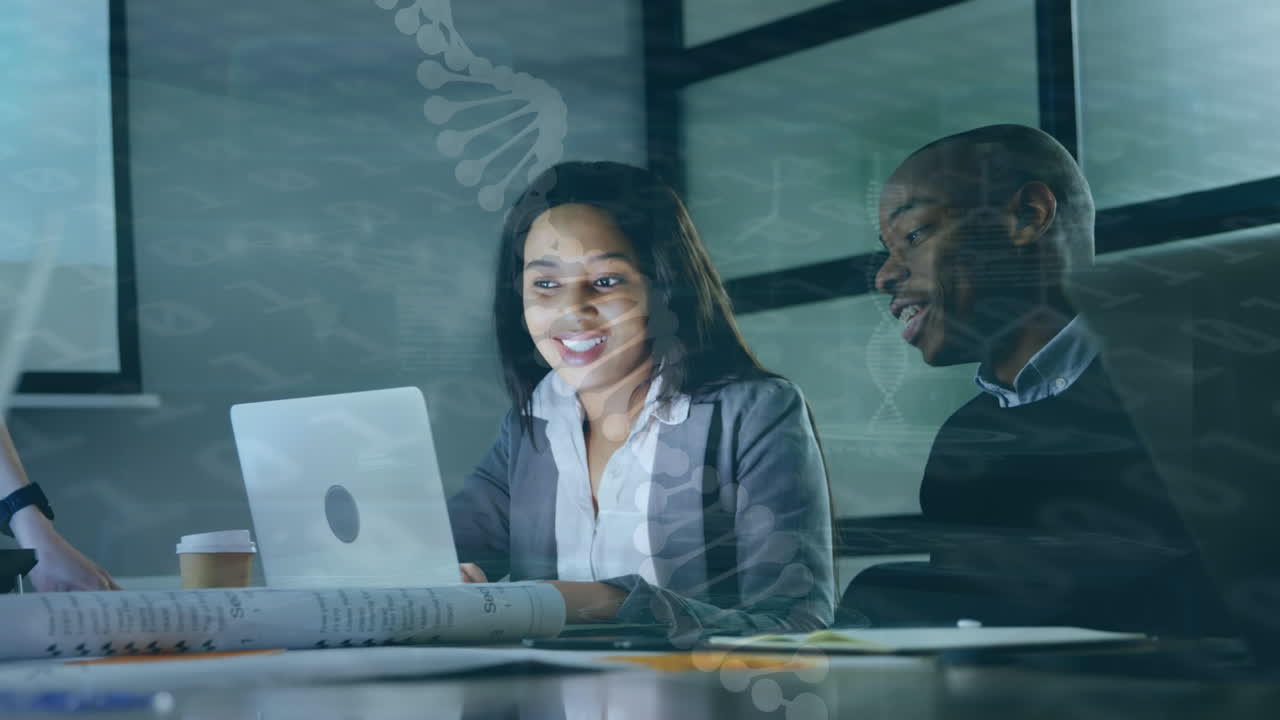 Animation of scientific data over diverse female and male coworkers using laptop