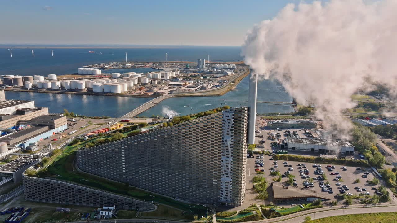 Aerial drone view of CopenHill artificial ski slope on the roof of an energy plant