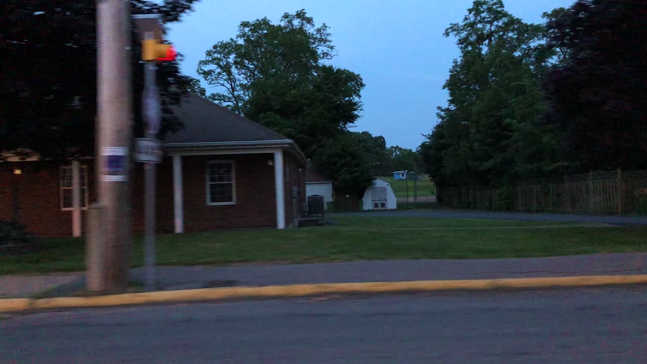 Driving by the municipal building and post office in Hantsport Nova Scotia Canada at dusk