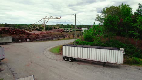 industrial chip mill brent, alabama with timber stacks and machinery