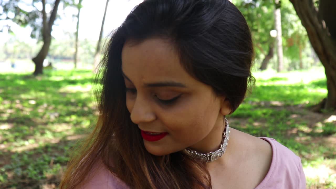 Beautiful Indian woman smiling and looking at the camera