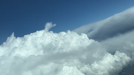 pov of an airplane flying above the clouds, floating clouds