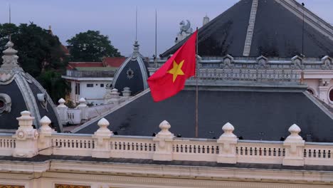 drone shot of vietnamese flag on a building in hanoi