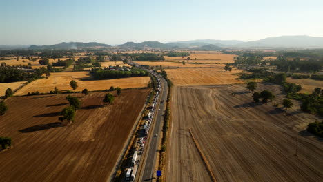 gridlocked vehicles, transport emergency, farming meadows, aerial view