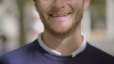 cheerful bearded man laughing outdoor