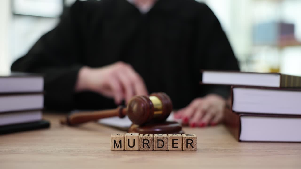 Judge with Gavel and "MURDER" Blocks